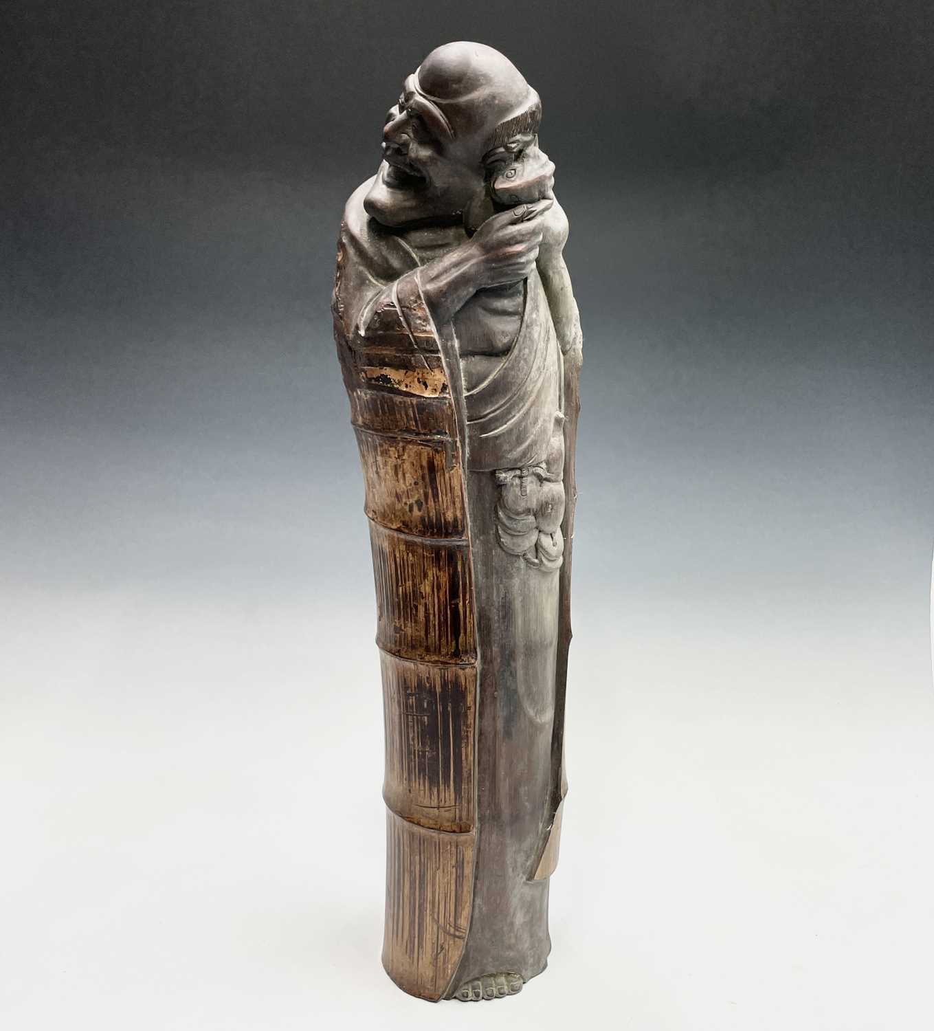 Lot 237 - A Chinese carved bamboo figure of Liu Hai,...