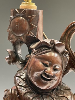 Lot 260 - A Chinese root wood carving of a smiling man...