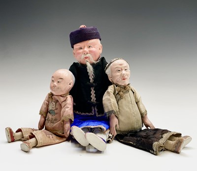 Lot 263 - Three Chinese dolls, in traditional costume,...