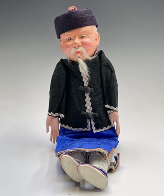 Lot 263 - Three Chinese dolls, in traditional costume,...