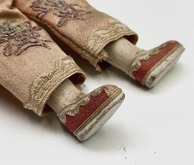 Lot 263 - Three Chinese dolls, in traditional costume,...