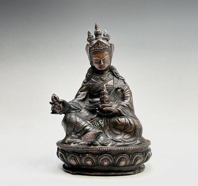 Lot 267 - A Tibetan bronze figure of a seated...