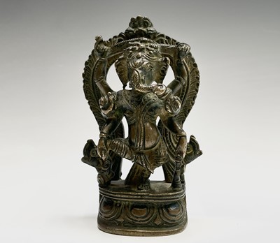 Lot 1047 - An Indian bronze figure of Ganesha, 19th...