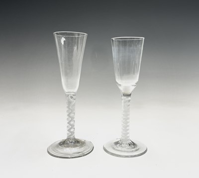 Lot 958 - Two 18th century wine glasses, each with white...