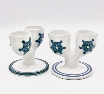 Lot 249 - Two Troika Pottery double egg cups, white with...