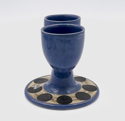 Lot 250 - A Troika Pottery double egg cup, blue glaze...