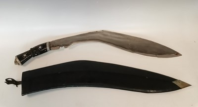 Lot 10 - An Indian Kukri machete with sheath. Blade...