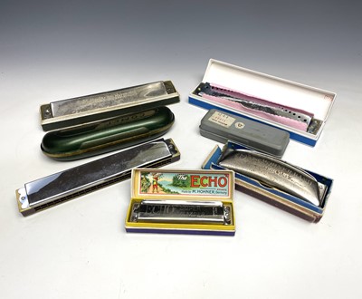 Lot 243 - A Hohner Band harmonica, boxed, together with...