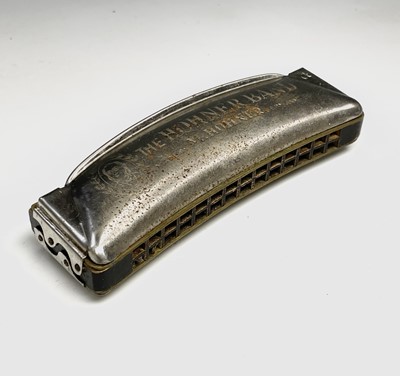 Lot 243 - A Hohner Band harmonica, boxed, together with...