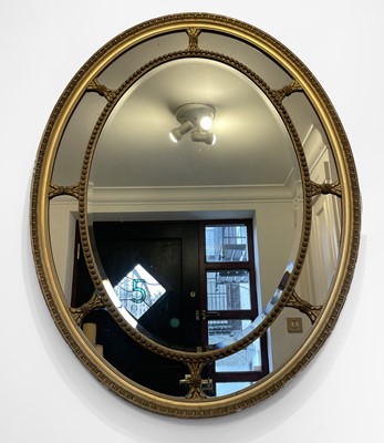 Lot 3135 - An Adams style oval gilt framed wall mirror,...