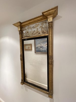 Lot 3139 - A Regency gilt mirror, the verre eglomise...
