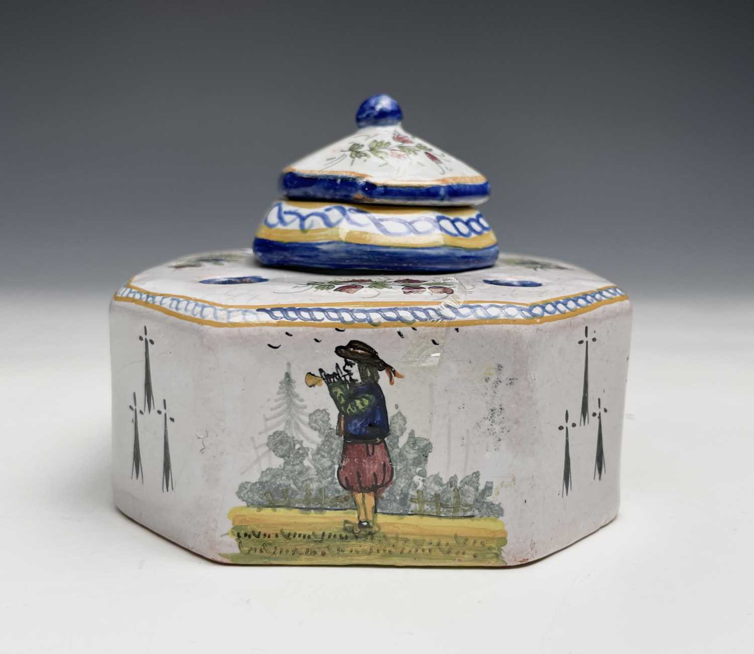 Lot 1018 - A French tin-glazed inkwell and cover with