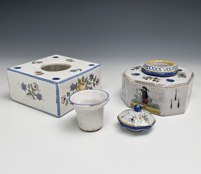 Lot 1018 - A French tin-glazed inkwell and cover with...