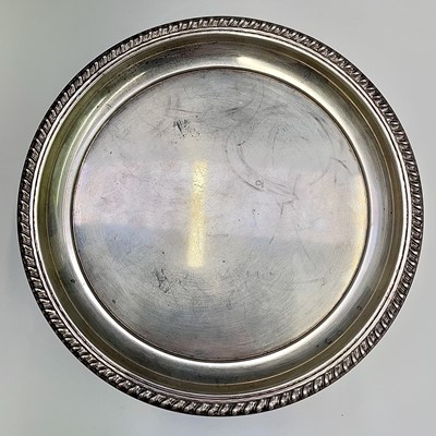 Lot 38 - A Cartier sterling card tray with gadrooned...