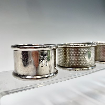 Lot 107 - Four silver napkin rings and a little silver...