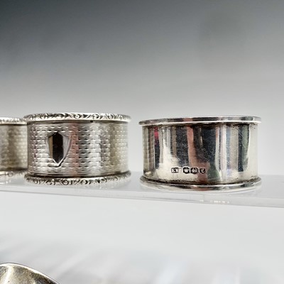 Lot 107 - Four silver napkin rings and a little silver...