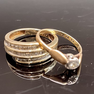 Lot 242 - A 9ct gold ring triple hoop set with diamonds...