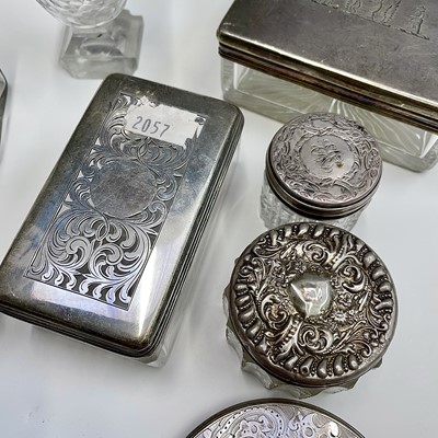 Lot 44 - Glass jars and silver lids