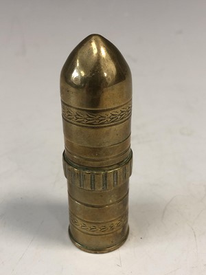 Lot 45 - A brass trench art cigarette lighter, height 7....