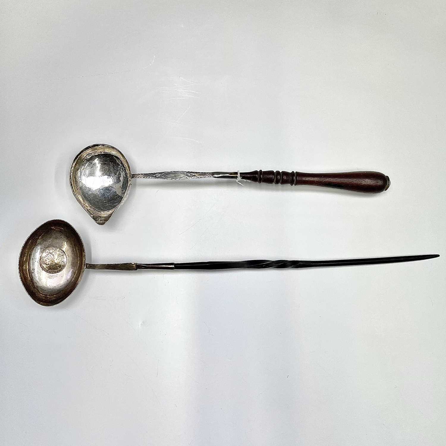 Lot 113 - Two Georgian silver punch ladles