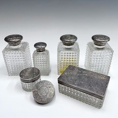 Lot 92 - A set of three Victorian cut glass jars with...