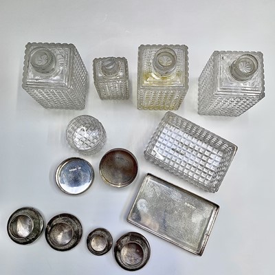 Lot 92 - A set of three Victorian cut glass jars with...