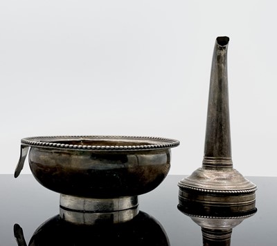 Lot 49 - A Georgian silver beaded two-part silver wine...