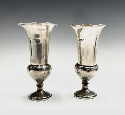 Lot 28 - A pair of silver thistle shape filled vases by...
