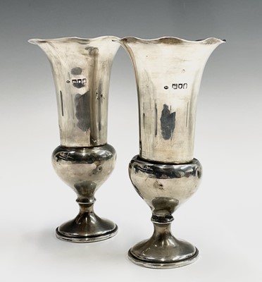 Lot 28 - A pair of silver thistle shape filled vases by...
