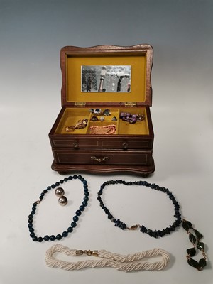Lot 30 - A wooden jewellery containing a pair of silver...