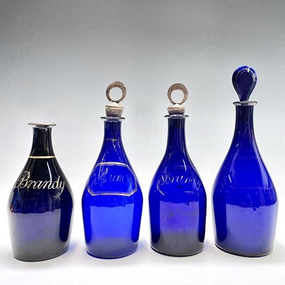 Lot 1031 - Four Georgian Bristol blue glass decanters,...