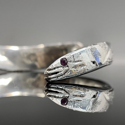 Lot 157 - A hand-crafted high purity silver eel bangle...