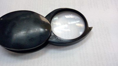 Lot 339 - A 20th century folding magnifying glass in...