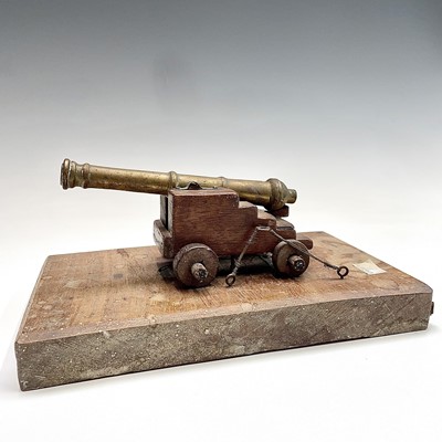 Lot 274 - A model cannon, with brass barrel, on a...