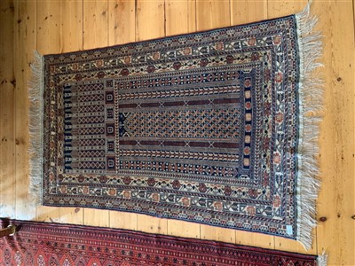 Lot 278 - A Belouch rug, the central mihrab filled with...