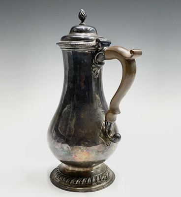 Lot 128 - A George III silver armorial bellied jug by...