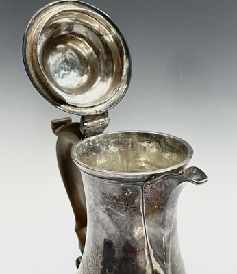Lot 128 - A George III silver armorial bellied jug by...
