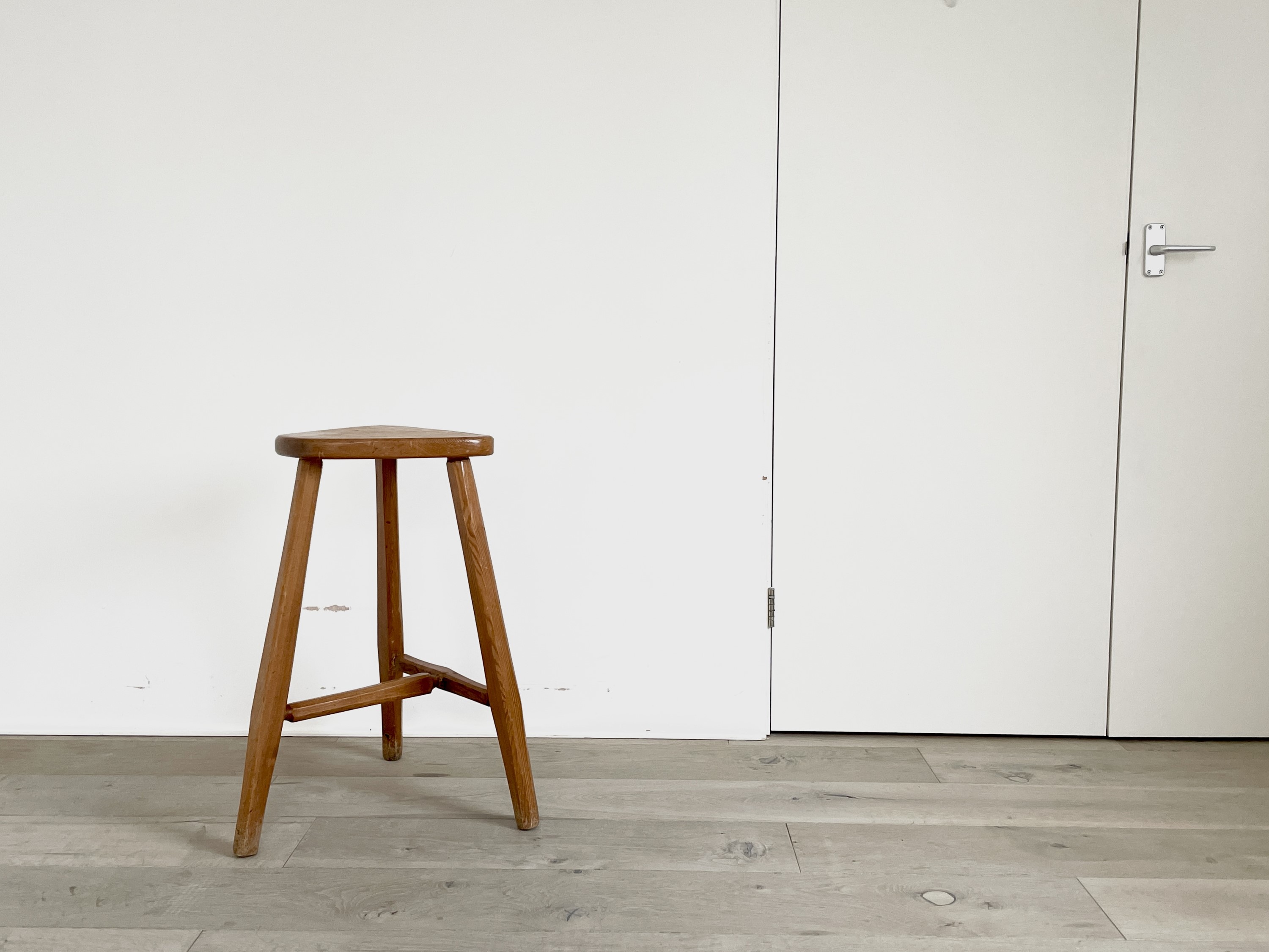 Lot 304 - A Robin Nance pine bar stool, the triangular