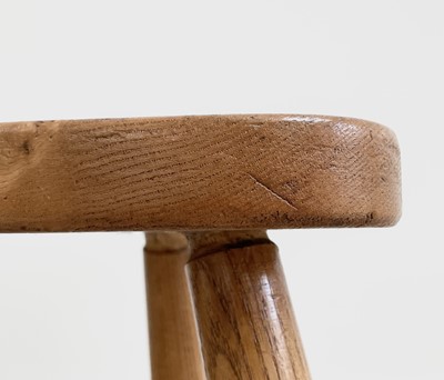 Lot 303 - A Robin Nance elm milking stool, with...
