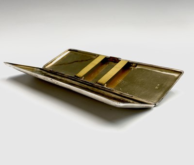 Lot 134 - An Art Deco engine-turned silver cigarette...