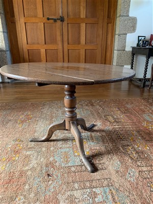 Lot 397 - A George III oak tripod table, the circular...