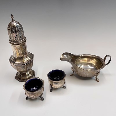 Lot 59 - A silver sugar caster, a silver sauce boat and...