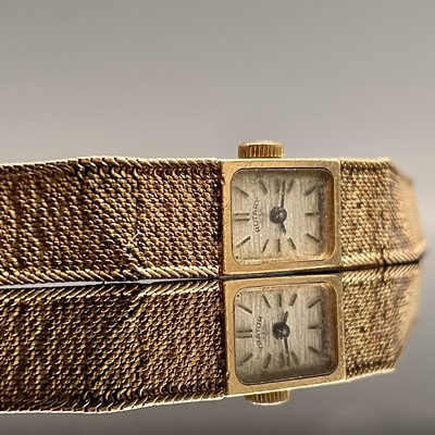 Lot 246 - A 9ct gold cased ladies wristwatch on 9ct gold...