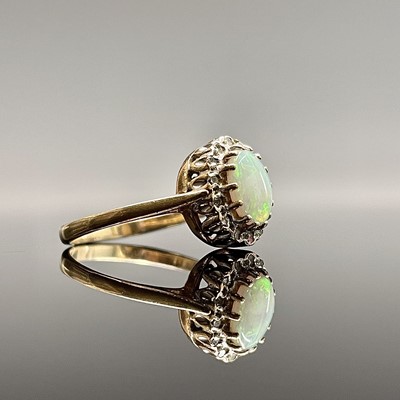 Lot 218 - A 9ct gold opal cluster ring with tiny...