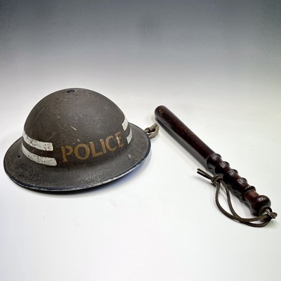 Lot 356 - A WWII steel police helmet, together with a...