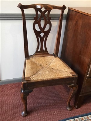 Lot 388 - Three George III oak dining chairs, each with...