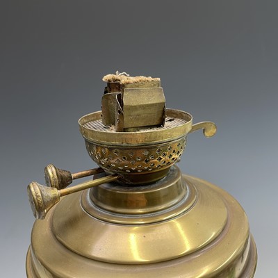 Lot 250 - A brass oil lamp, circa 1900, with fluted...