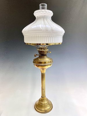 Lot 250 - A brass oil lamp, circa 1900, with fluted...