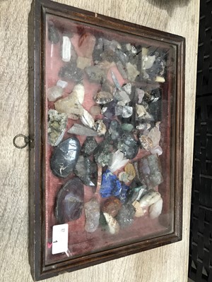 Lot 1 - A glazed table top display case containing a...