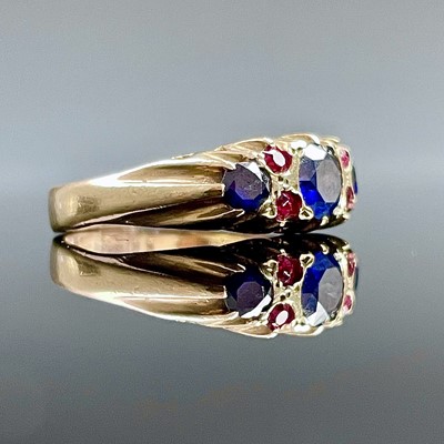 Lot 769 - An Edwardian 9ct gold ruby and saphire ring...